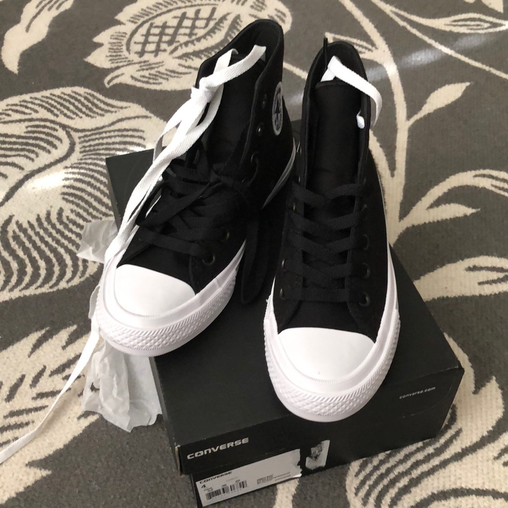 Black and white high top converse